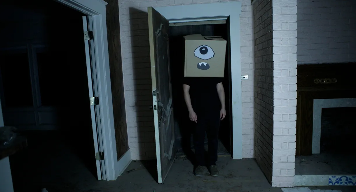 A Ghost and the Boy with a Box on His Head